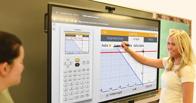 A person with a yellow shirt writing on a screen that displays the NumWorks emulator